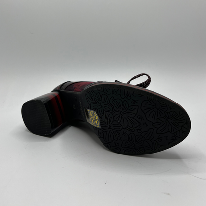 Black shoe sole with textured pattern on a white background