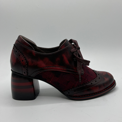Red mix shoe with a block heel on a white background