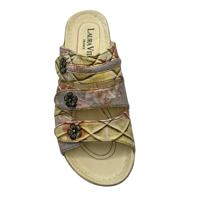 Top view of leather slip on sandal with low wedge heel and metal flower details on the straps