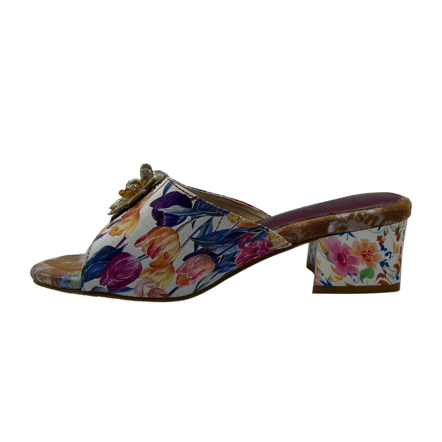 Left facing view of floral slip on sandal with flower accents on upper. Open toe and block heel