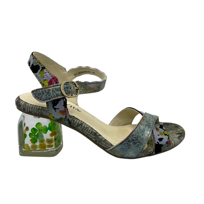 Right facing view of patterned leather sandal with buckle ankle strap, crossed straps on toe and block lucite heel