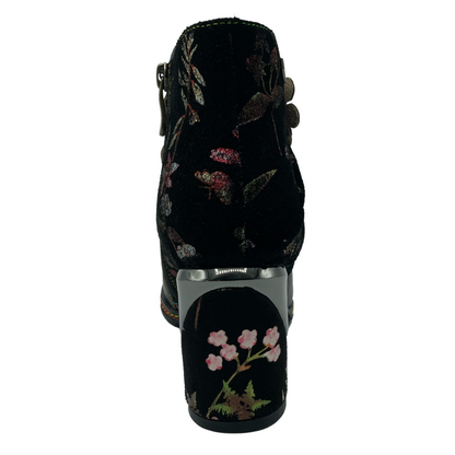 Back view of leather ankle boot with floral suede details and block heel