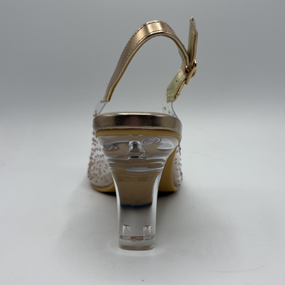 Rose gold high-heeled shoe with clear heel on a gray background