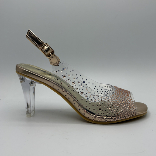 Clear high-heeled shoe with rhinestone embellishments on a gray background