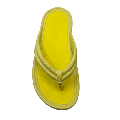 Top view of lemon yellow thong sandal with cushioned foam insole and platform sole