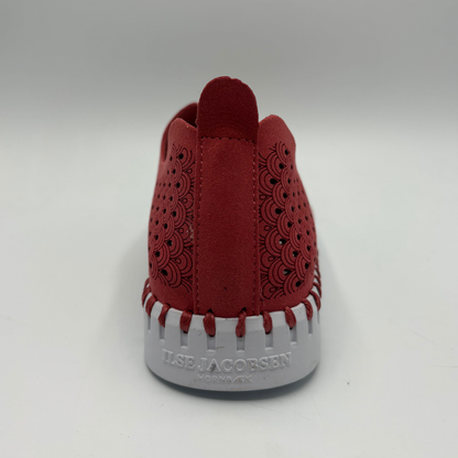Red shoe with white sole on a gray background