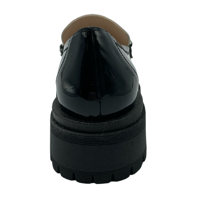 Back view of patent leather loafer with chunky black rubber sole
