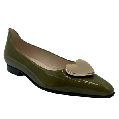 45 degree angled view of green patent leather ballet flat with pointed toe, gold heart on upper and short heel