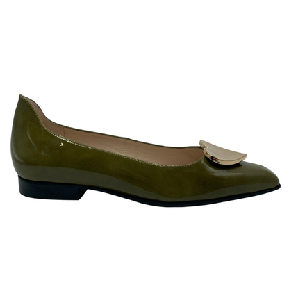 Right facing view of green patent leather ballet flat with pointed toe, leather lining insole and gold heart detail on upper