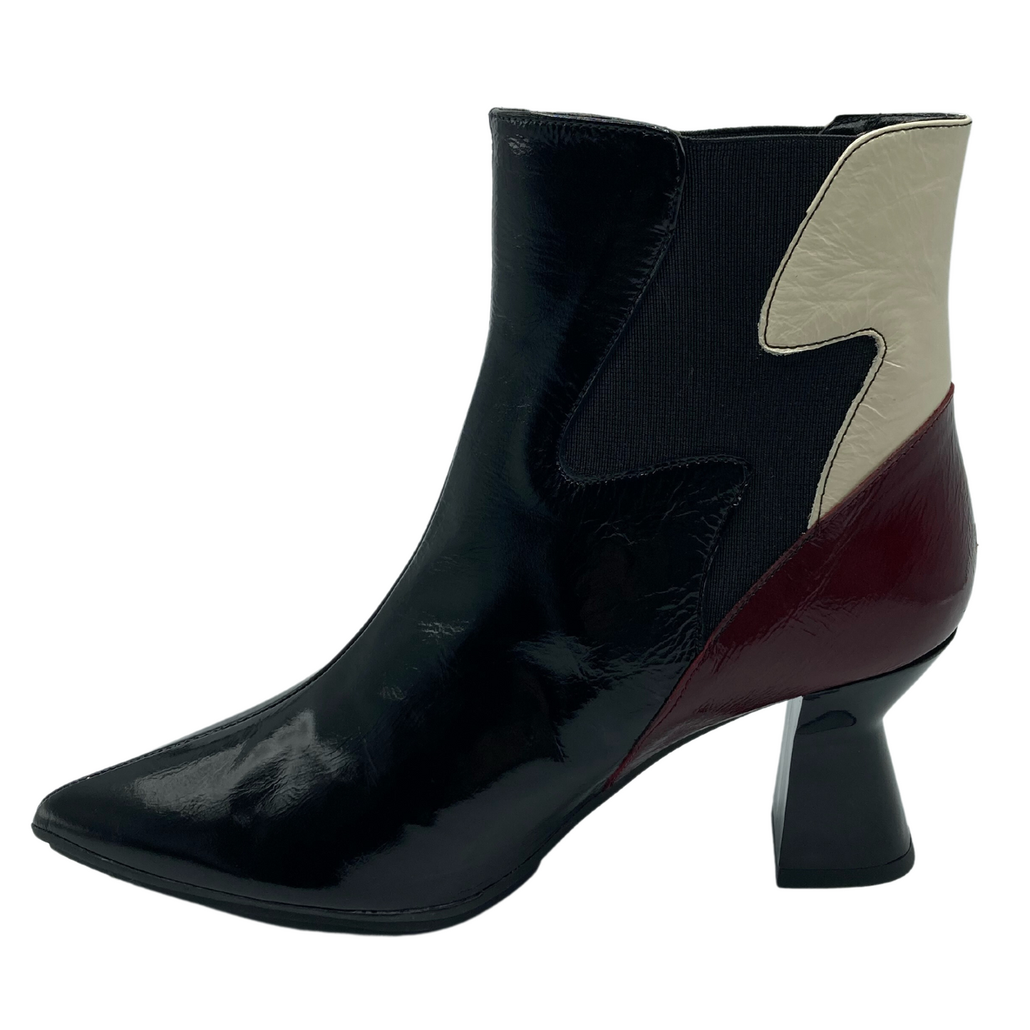 Left facing view of leather ankle boot with flared heel and pointed toe