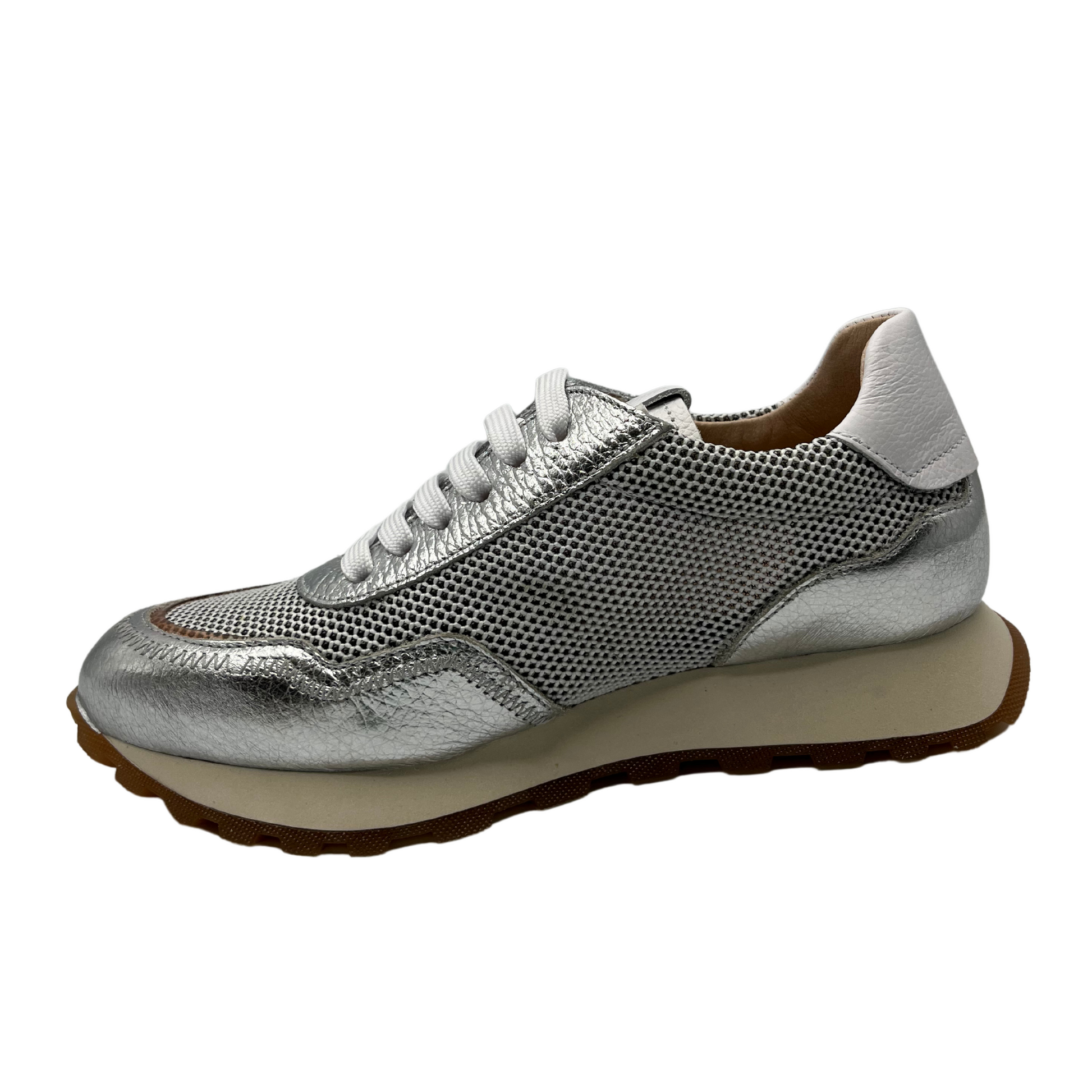 Left facing view of silver and white leather sneaker with non-slip sole and leather lining.