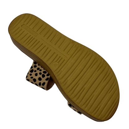 Bottom view of cheetah print leather sandal with gold buckle and brown insole
