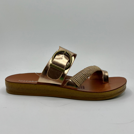 Right facing view of a rose gold strapped sandal with a gold buckle and brown insole
