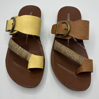 Pair of brown sandals with yellow and tan straps on a white background