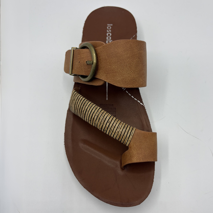 Brown sandal with a strap on a white background