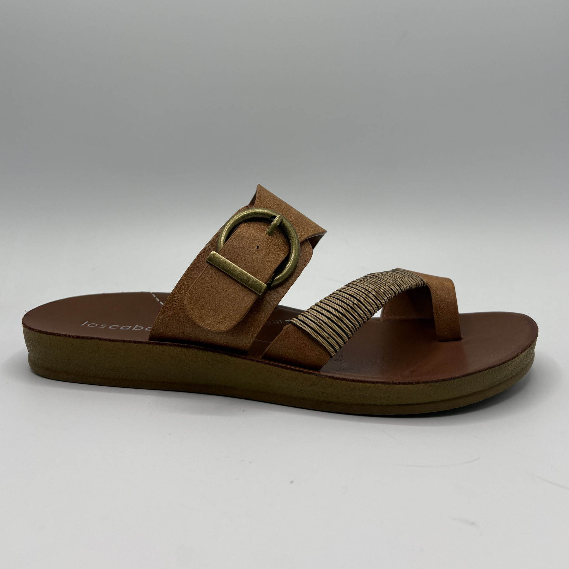 Brown sandal with a gold buckle on a white background