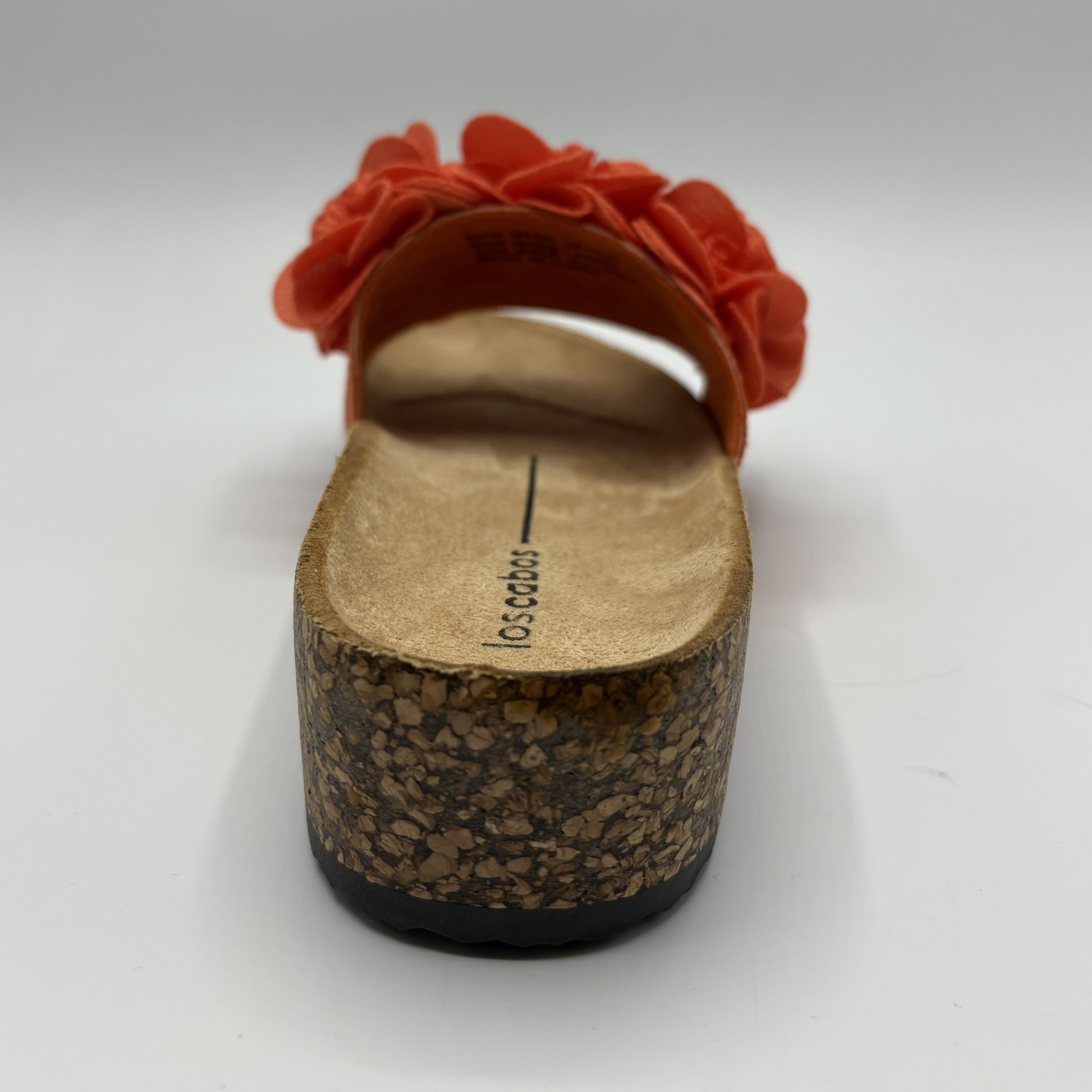 Cork sandal with orange flower detail on a white background