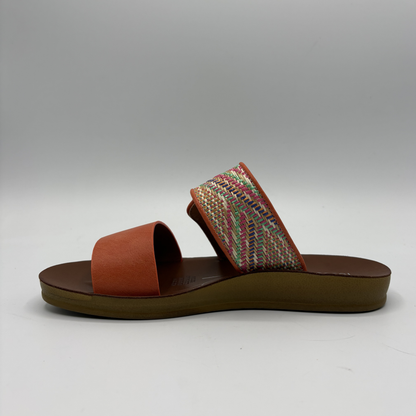 Left view of a tangerine coloured sandal with two straps