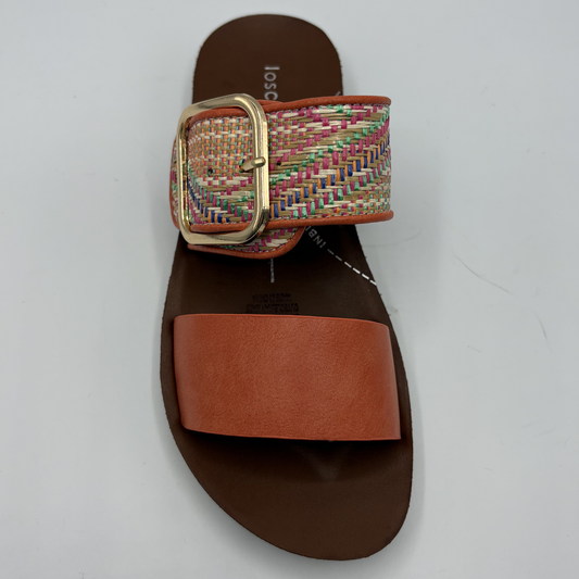 Top view of a tangerine coloured sandal with two straps