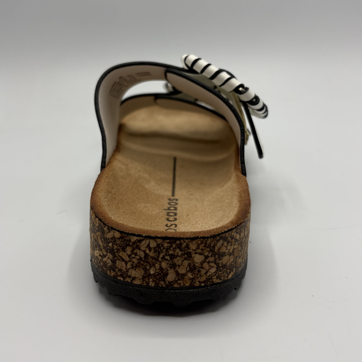 Cork sandal with a striped patterned strap on a white background