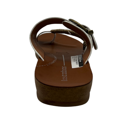 Back view of white leather sandal with gold buckle and brown insole