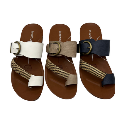 Upper view of three sandals in a row. Left one is white, middle one is taupe and right one is navy. All have brown insoles