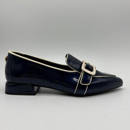Right facing view of a dark blue patent leather loafer with a pointed toe and a buckle strap accent