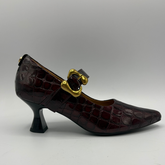Right facing view of a burgundy high heeled shoe with a flared heel and gold buckle