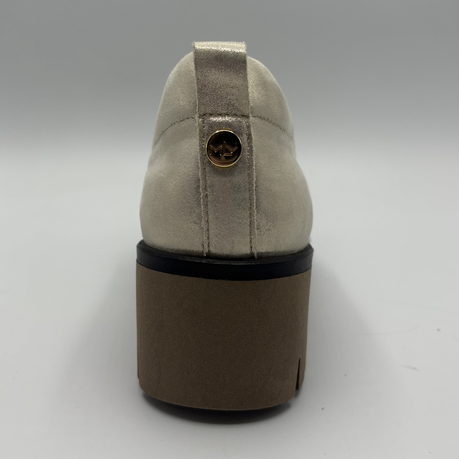 Back view of a metallic leather loafer with a rubber outsol