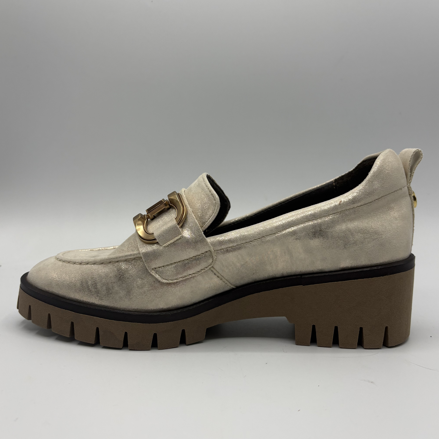 Left facing view of a metallic leather loafer with a rubber outsol