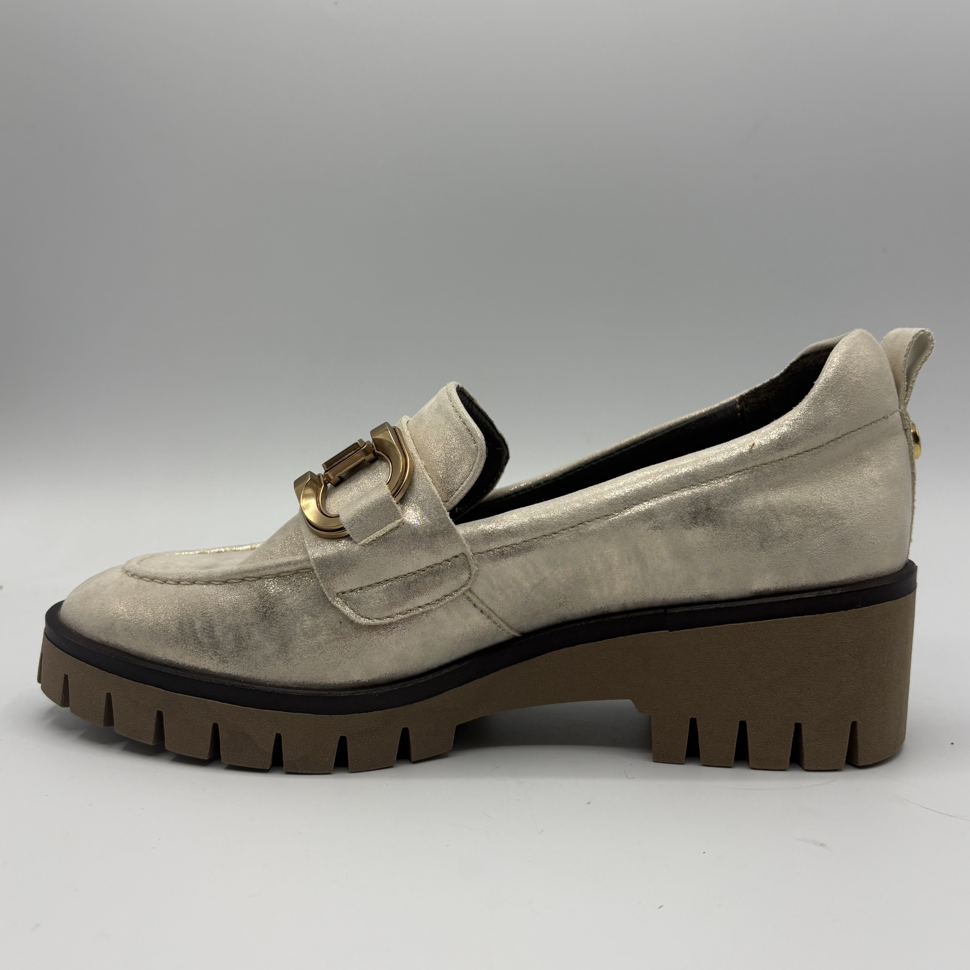 Left facing view of a metallic leather loafer with a rubber outsol