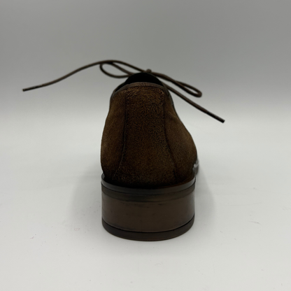 Back  view of a brown oxford shoe with a short stacked heel and matching laces