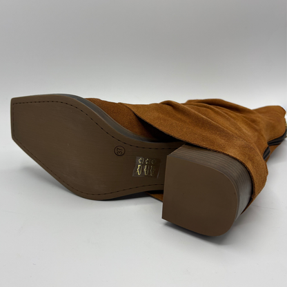 Bottom facing view of a brown suede western style slouchy boot