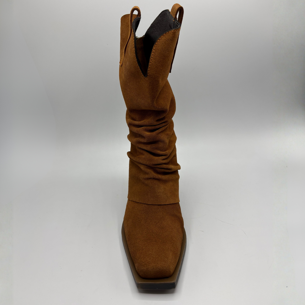 Front facing view of a brown suede western style slouchy boot