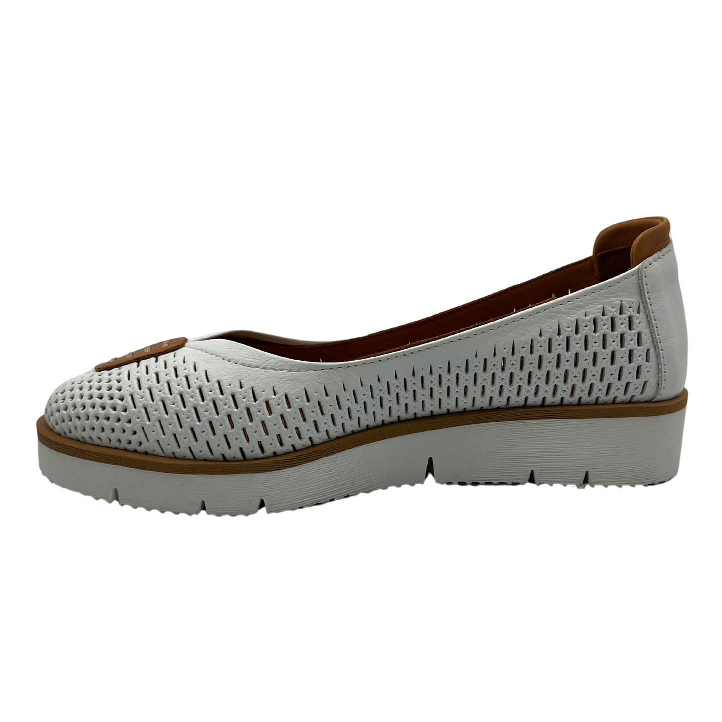 Left facing view of white perforated leather flat with thick outsole and leather lining