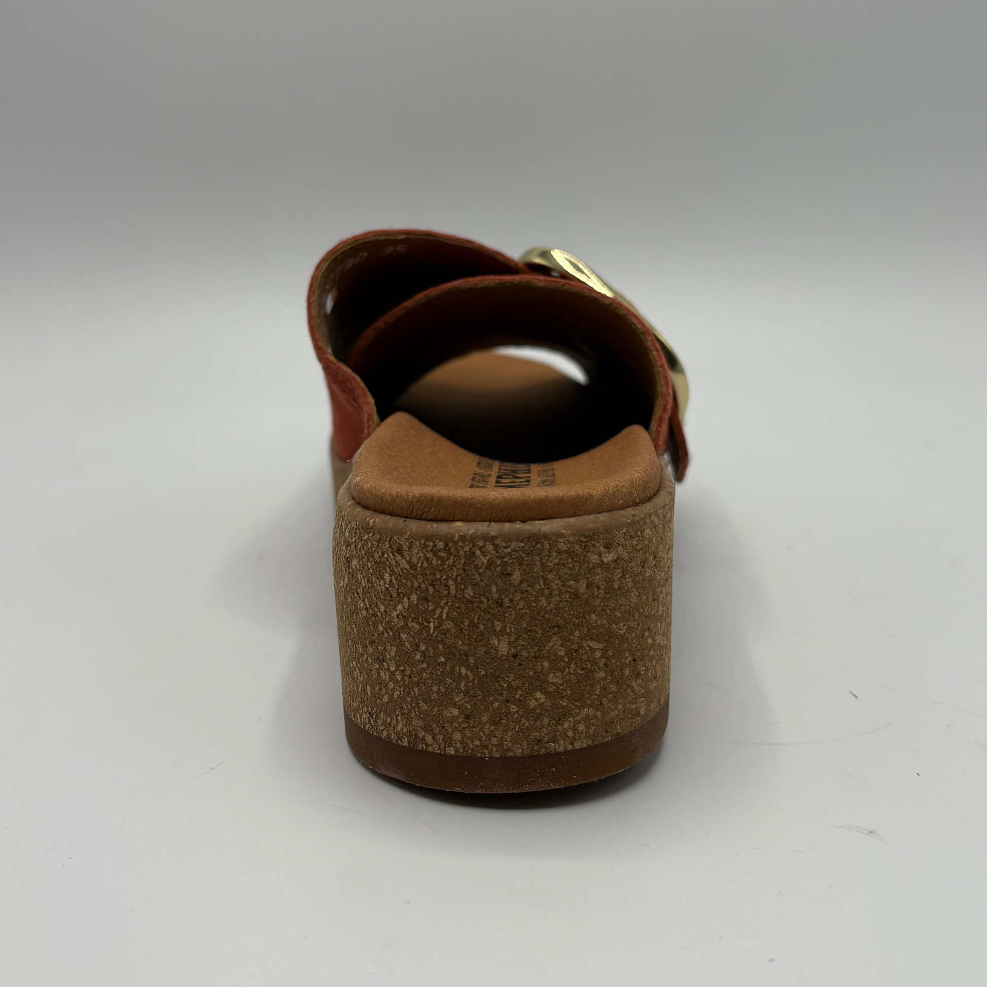 Brown sandal with cork sole on a white background