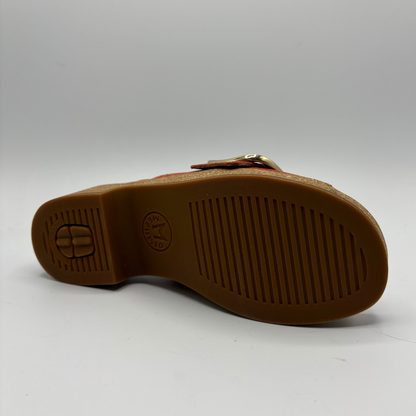 Brown sandal sole with brand logo on a white background