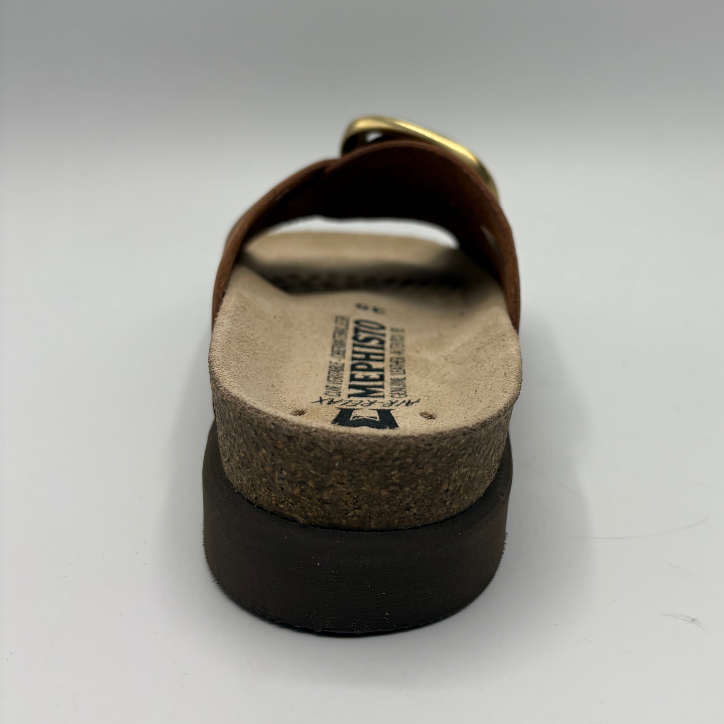 Brown sandal with cork sole on a white background