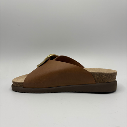 Brown sandal with a cork sole on a white background