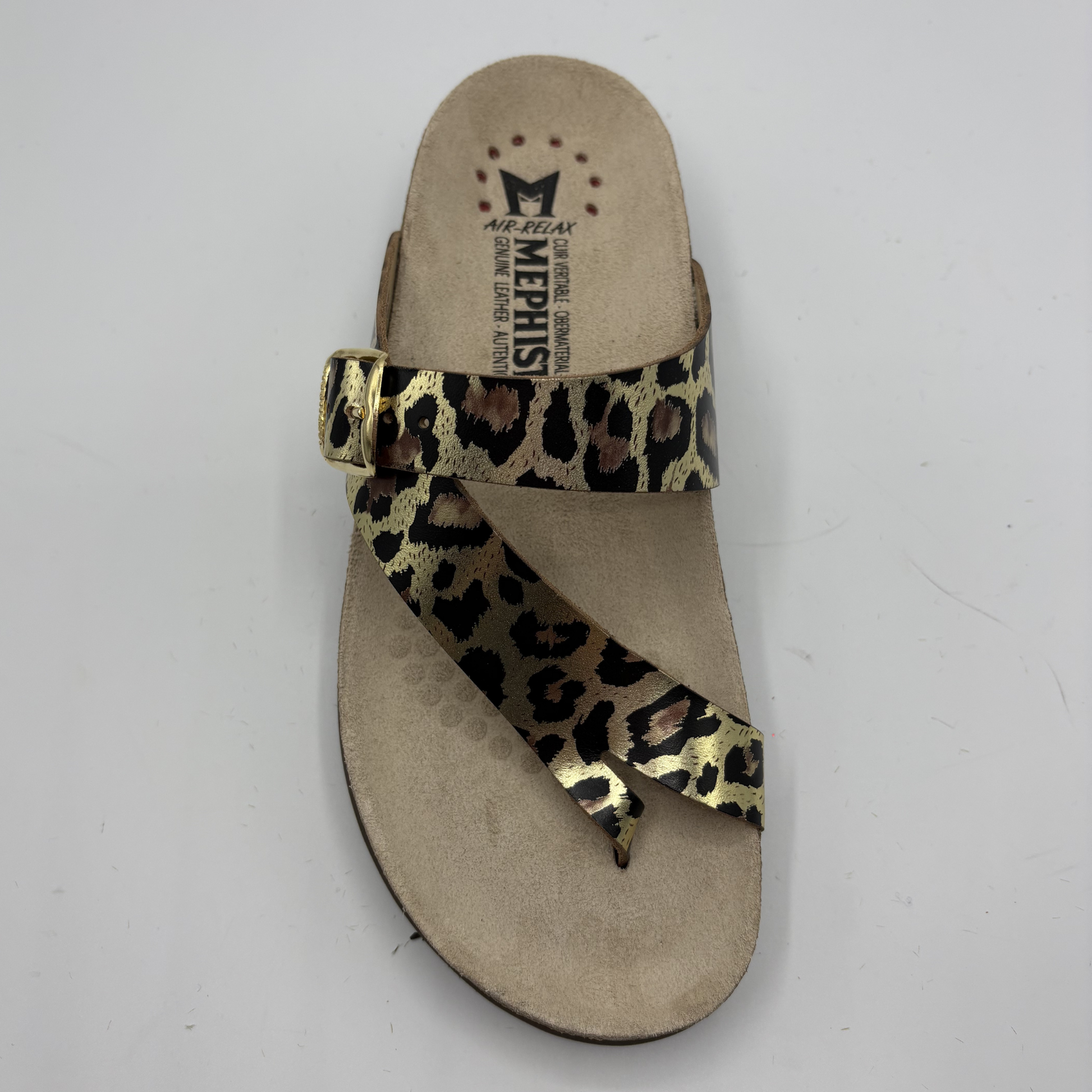 Beige sandal with leopard print strap on a white background