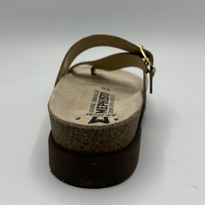 Brown sandal with cork sole on a white background