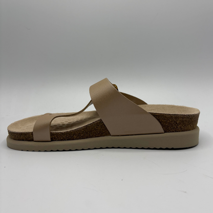 Beige sandal with cork sole on a white background