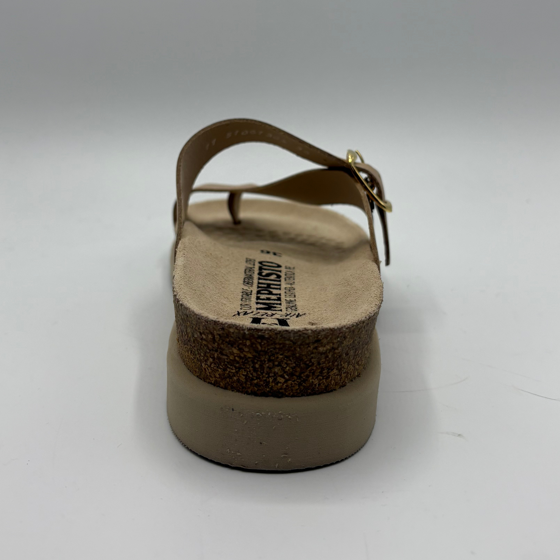 Brown sandal with cork sole on a white background