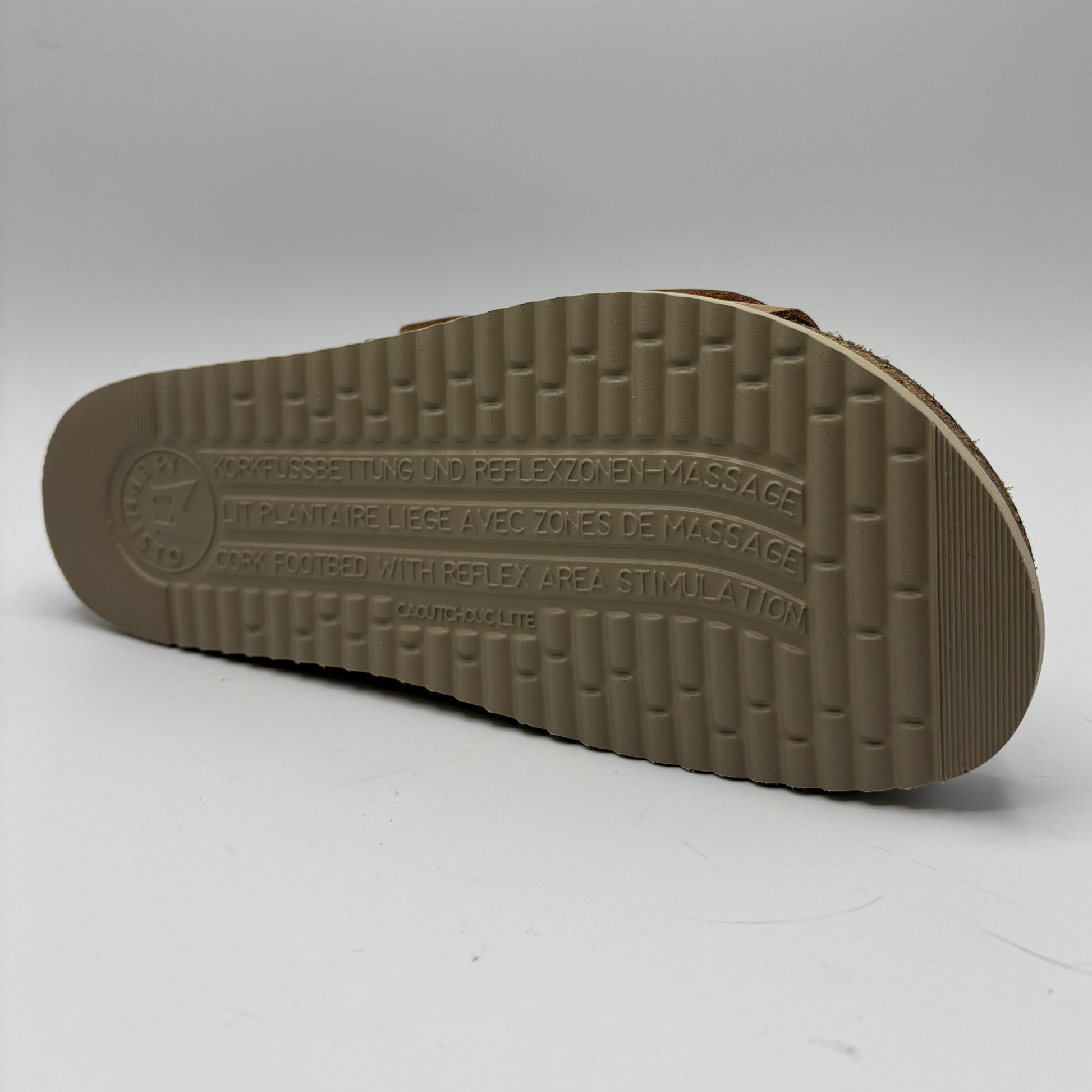 Brown sandal sole with text on a white background
