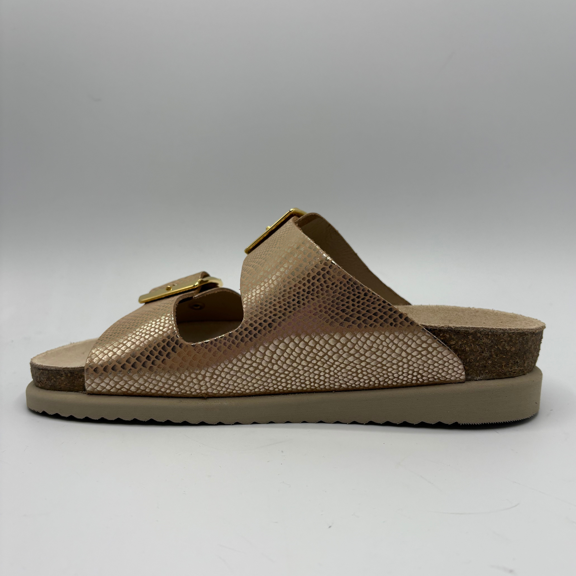 Brown sandal with a gold buckle on a white background