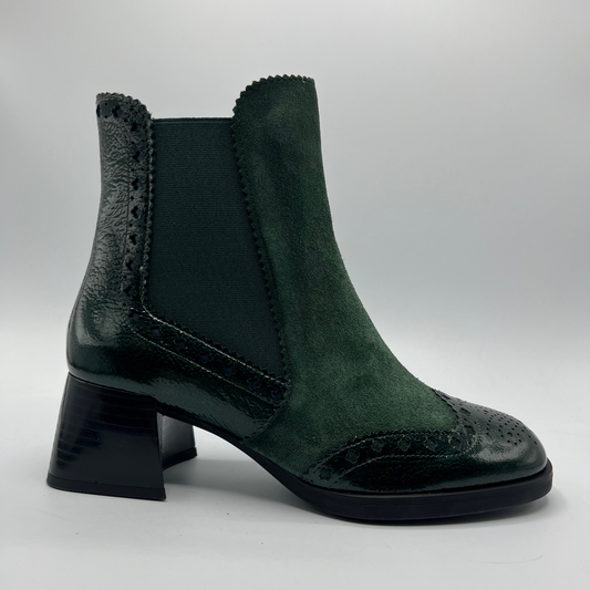 Green ankle boot with a block heel on a white background