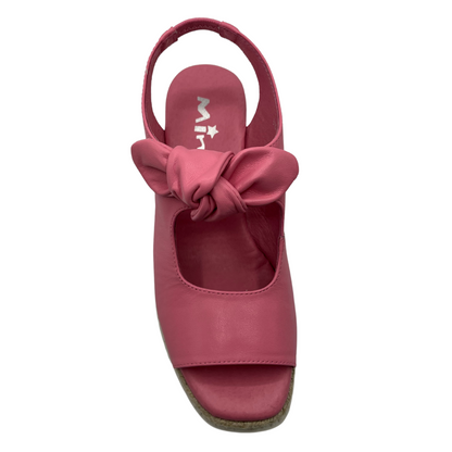 Top view of pink leather wedge sandal with slingback strap and bow detail