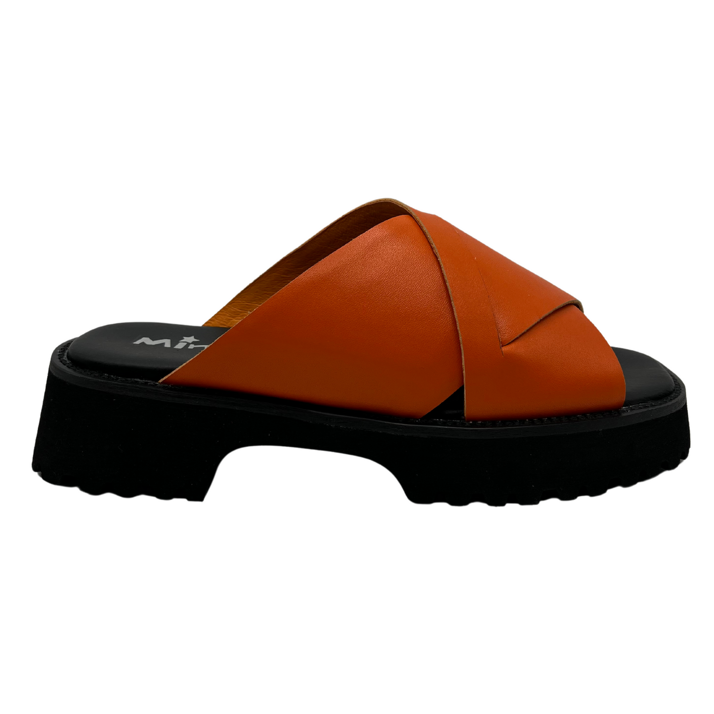 Right facing view of orange leather sandal with thick black sole, cross over straps and open toe
