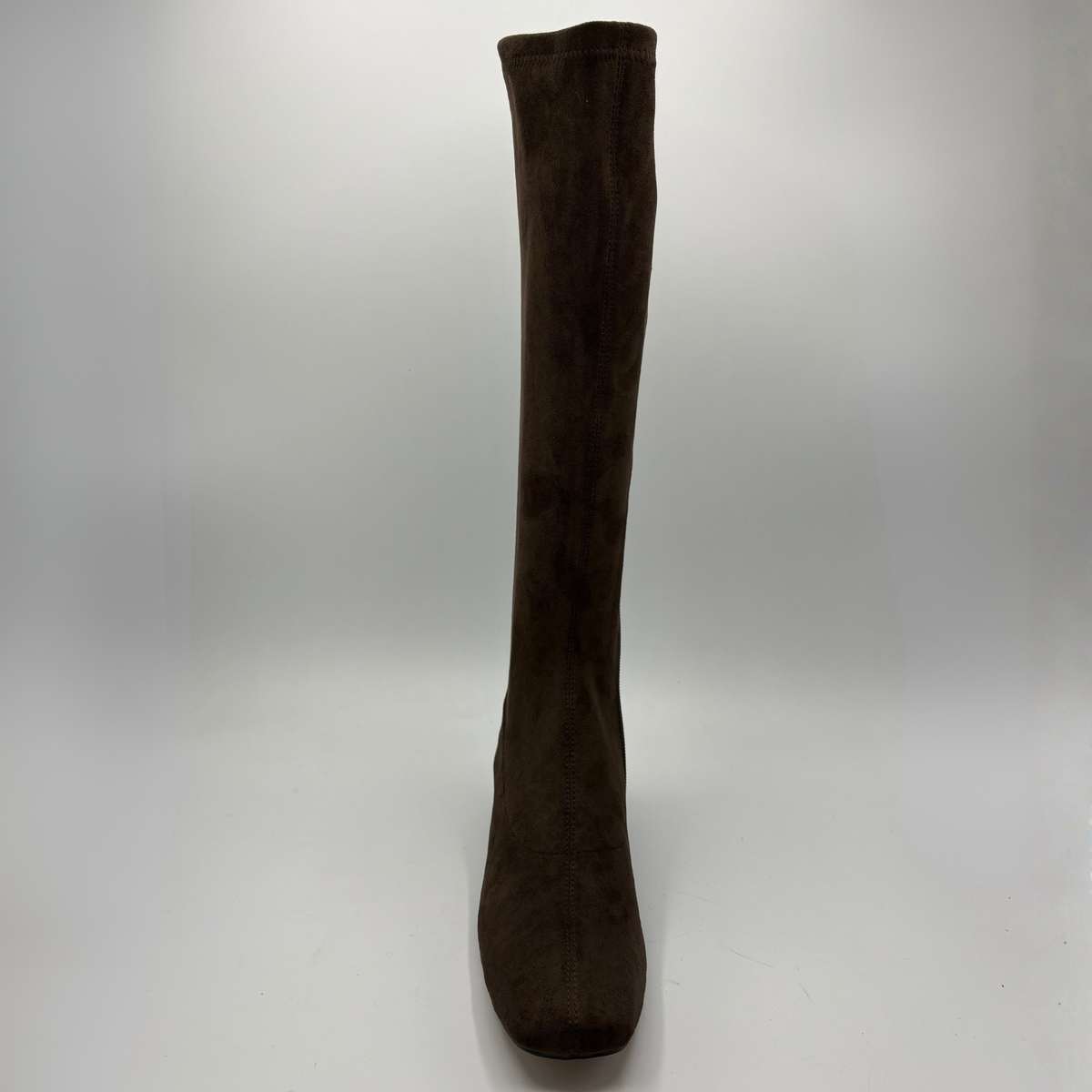 Front view of a brown suede tall boot with a wrapped heel