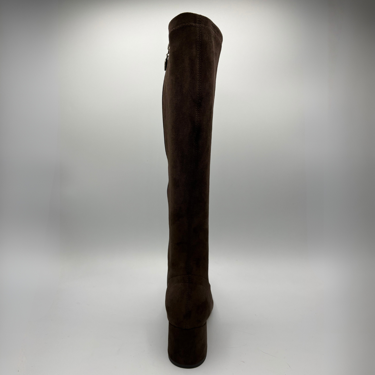 Back view of a brown suede tall boot with a wrapped heel